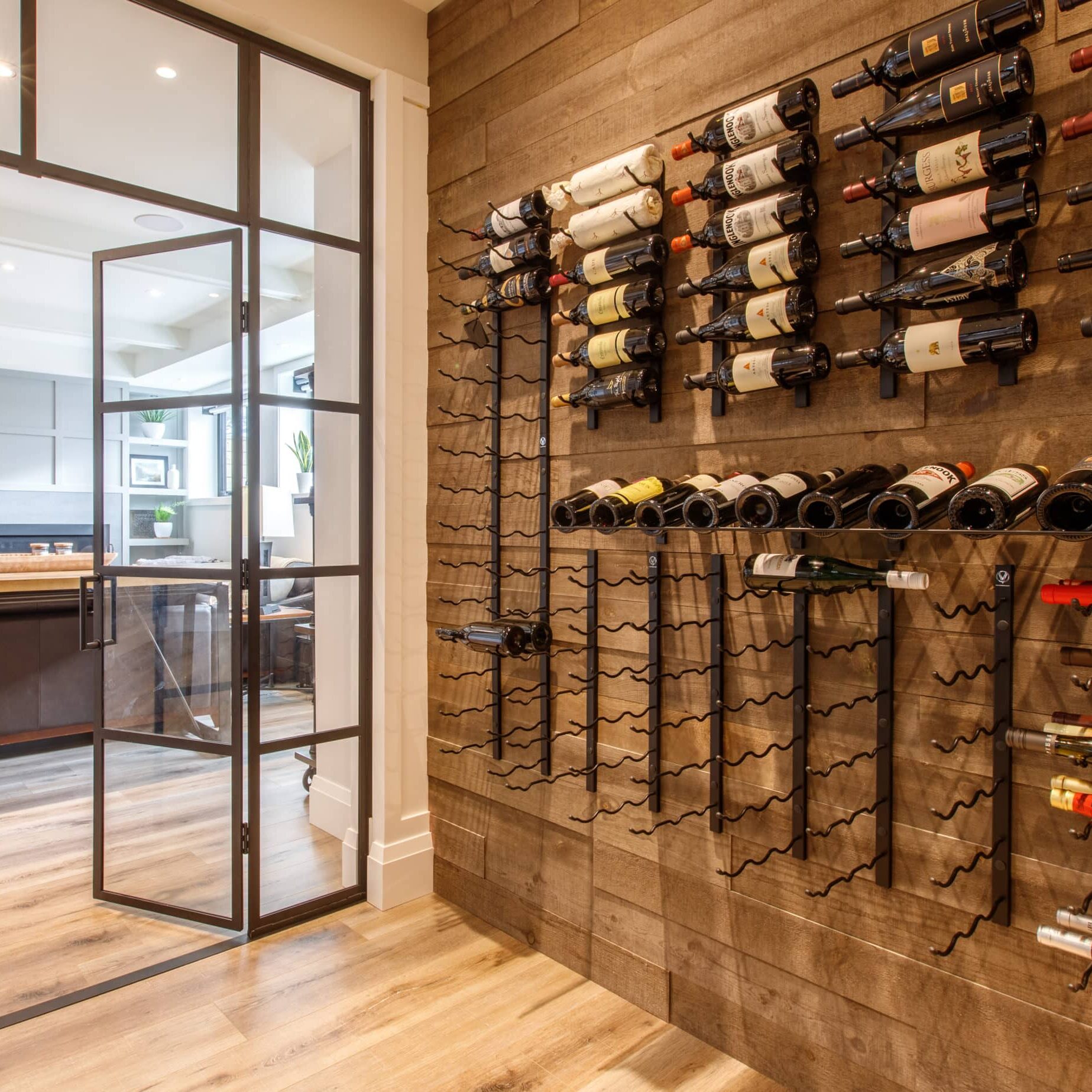Wine room seen from inside and out towards kitchen with display